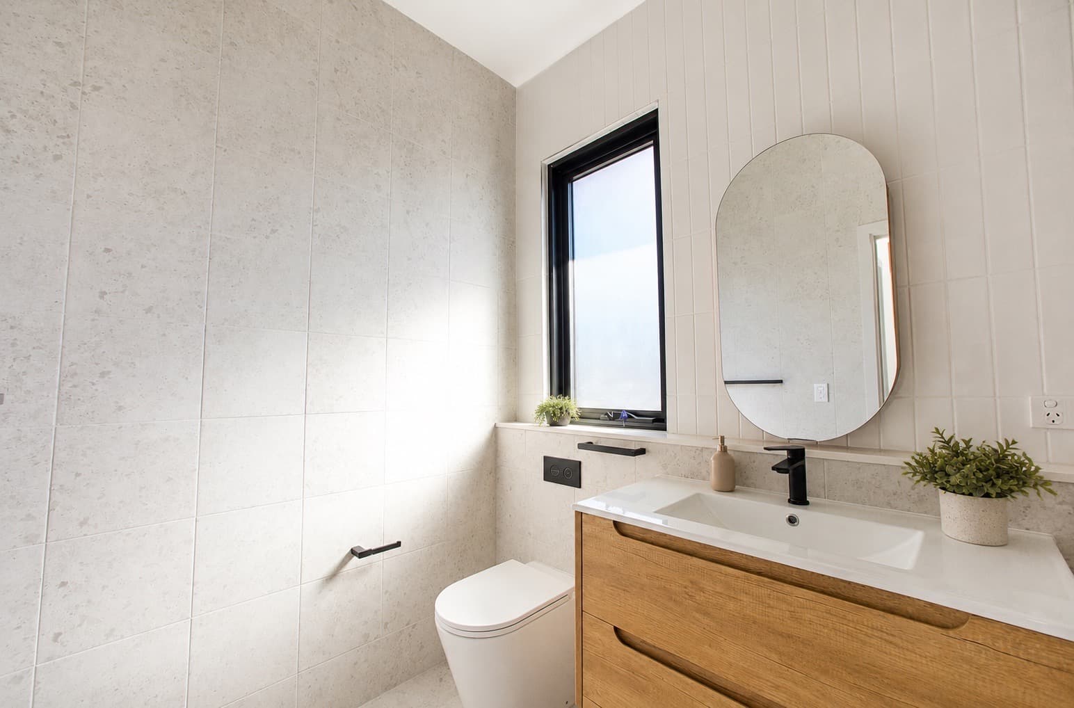 Bathroom vanity and full-height tiling